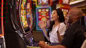 image of couple playing slots at Grand Sierra Resort