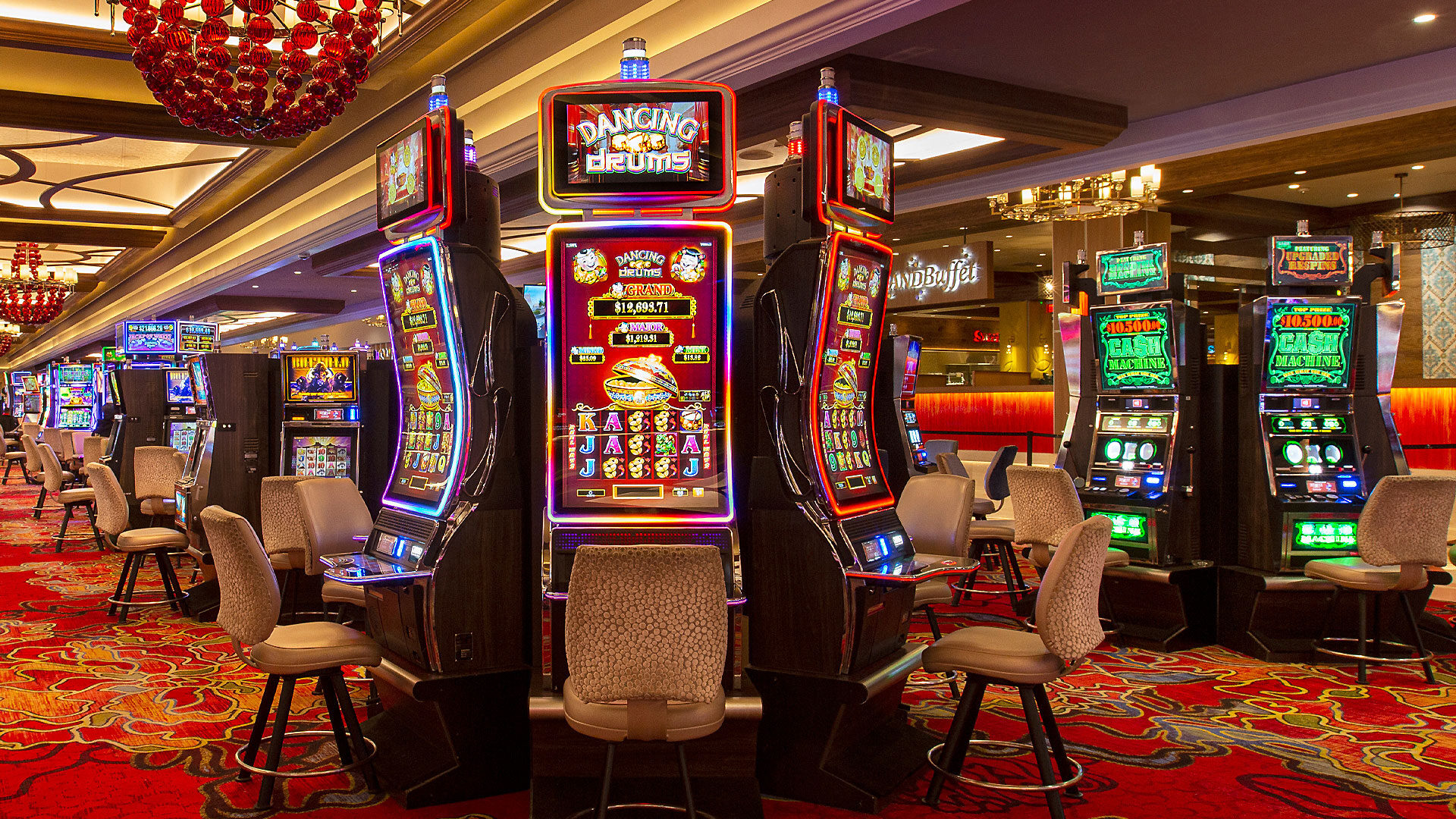 A casino floor with slot machines and seating areas.