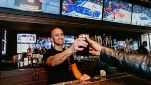 Bartender serving a pint at Chickie's & Pete's, SAHARA Las Vegas.