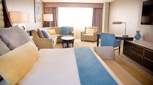 Sierra Deluxe King Room view of bed and living areas.