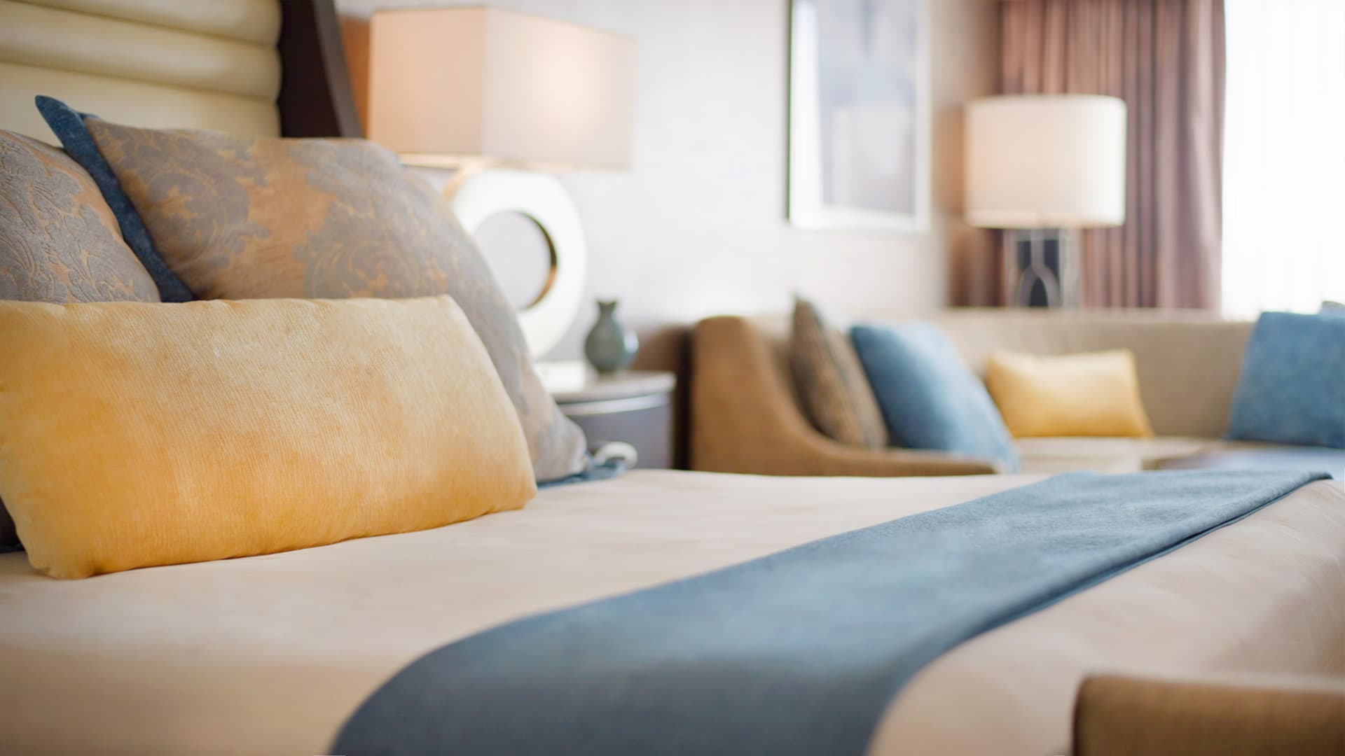 A close-up view of a bed with pillows and a blanket