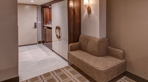 Vista Two Queen Room view of settee and armoire