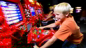 Photo of child enjoying an arcade games in Fun Quest at GSR.