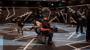 Photo of players enjoying free-roaming VR action at Max Action Arena.