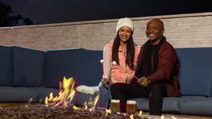 Photo of couple preparing s'mores at fire pits at The Pool.