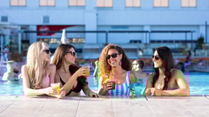 Photo of ladies enjoying drinks in the Infinity Pool at GSR.